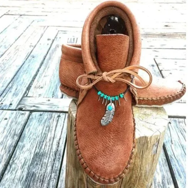 Mocassins indiens montants avec plumes décoratives