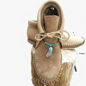 Mocassins indiens montants avec plumes décoratives
